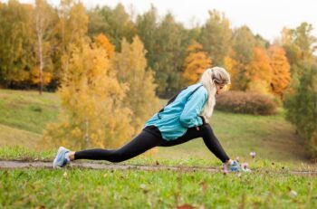 Elder athlete stretching showing how to exercise safely with RA